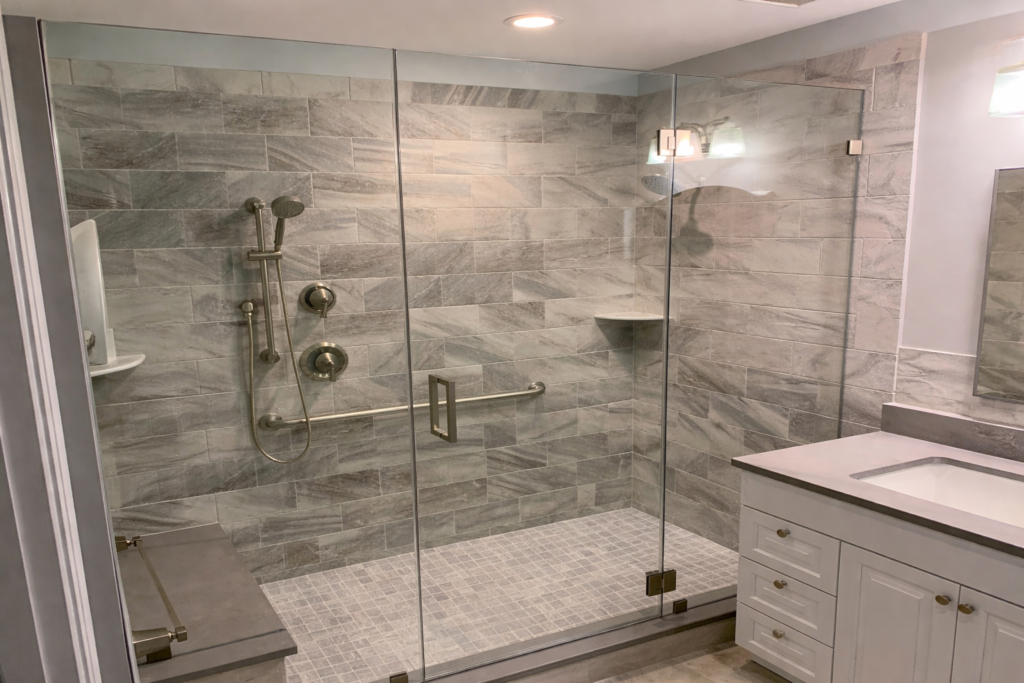 Glass to Glass Inline shower door and panels installed by Harmony Glass