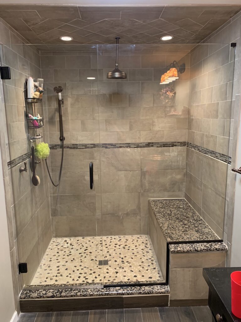 Inline shower with Door and Panel and Seat Cutout INstallation by Harmony Glass NJ