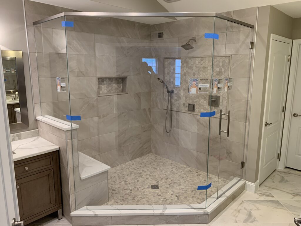 Large Neo Angle Shower with a knee wall and header cutout by Harmony Glass NJ