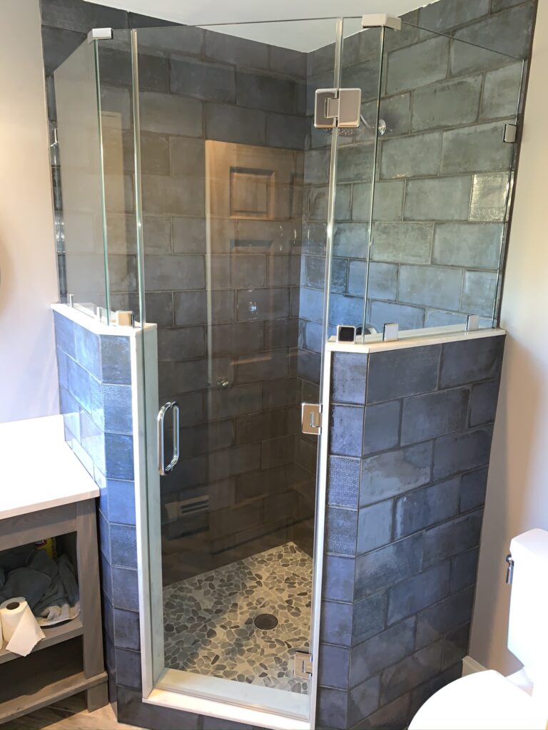 Neo Angle Shower with a pair of Knee Walls and Centered Door