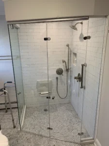 Design and Installation by Harmony Glass Bifold ADA compliant shower